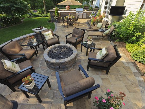 Back yard gardens and patio from an elevated view.